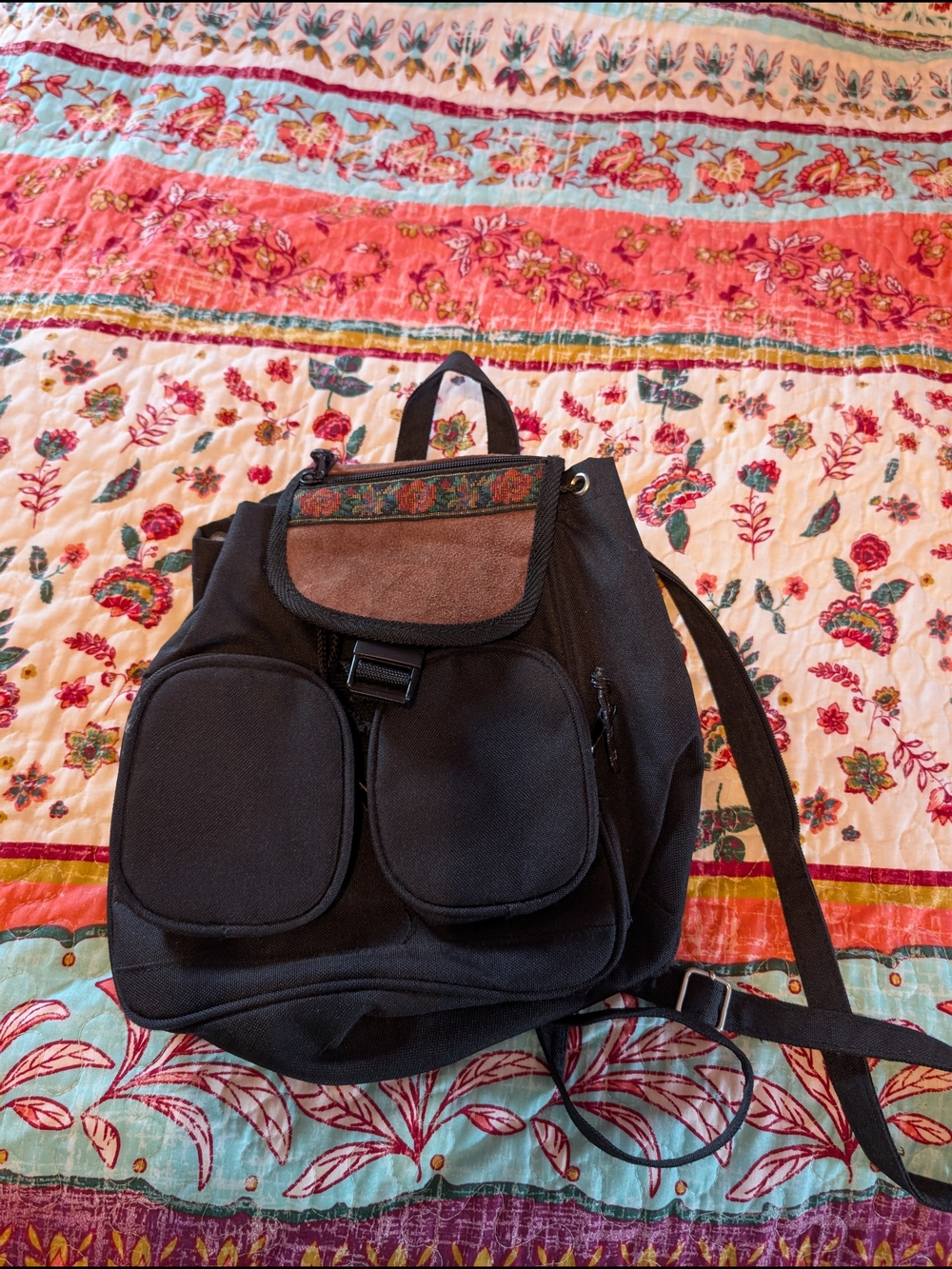 Black Canvas Backpack with Embroidered Flap and Suede Accent